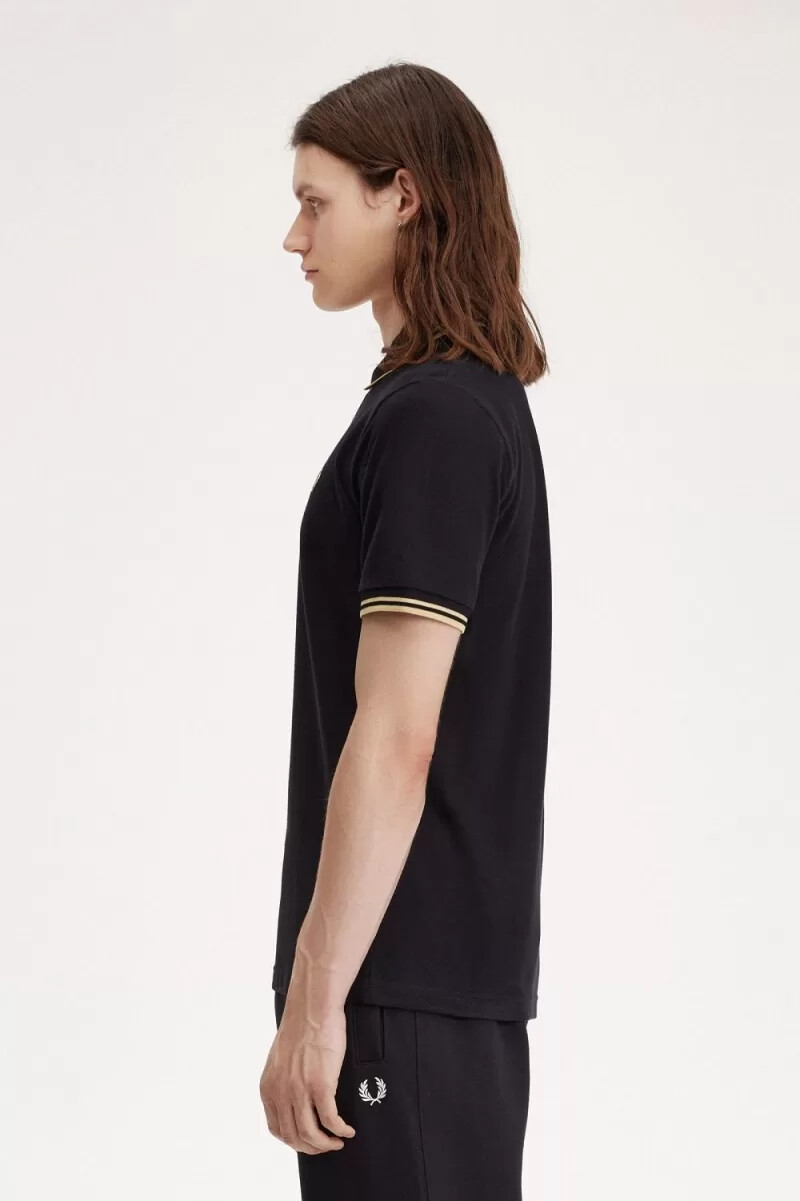 fred perry osaka m12 herr pikétröja svart champagne