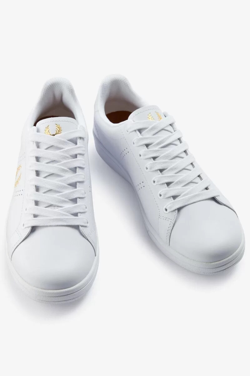 fred perry b721 herr tennisskor vita metalliska guld