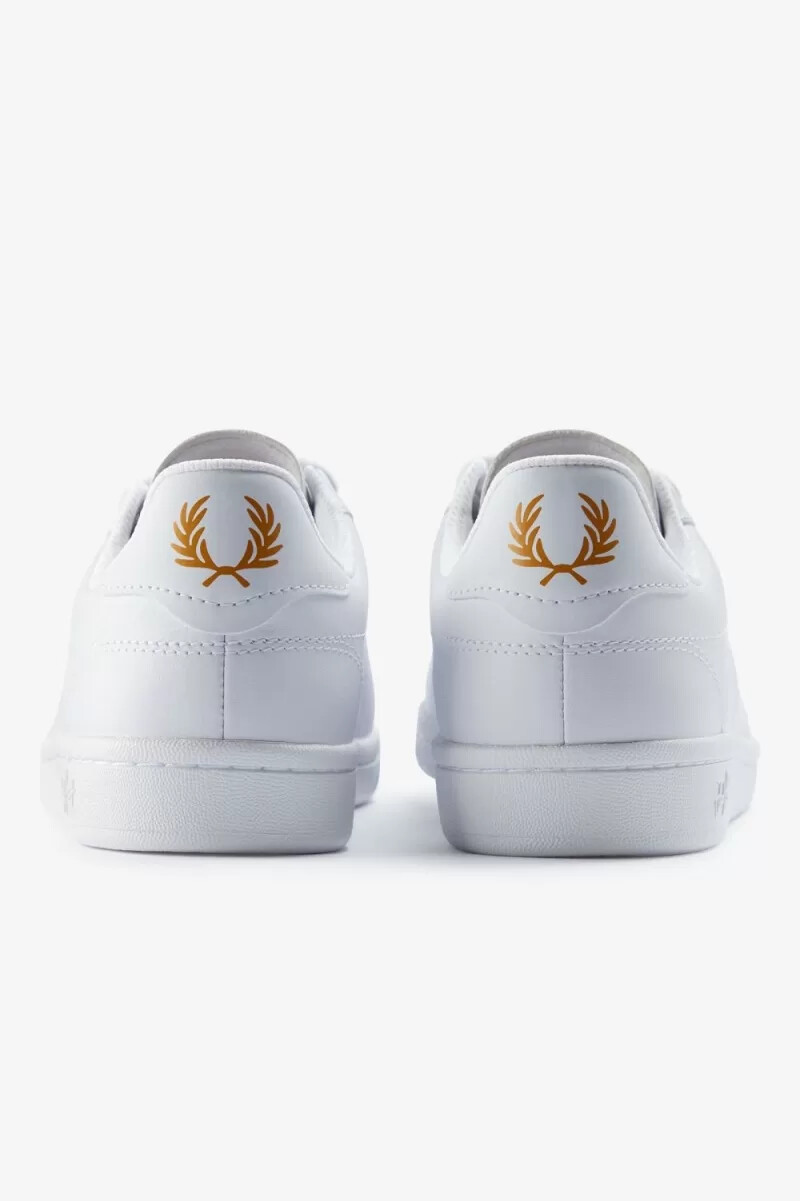 fred perry b721 herr tennisskor vita metalliska guld